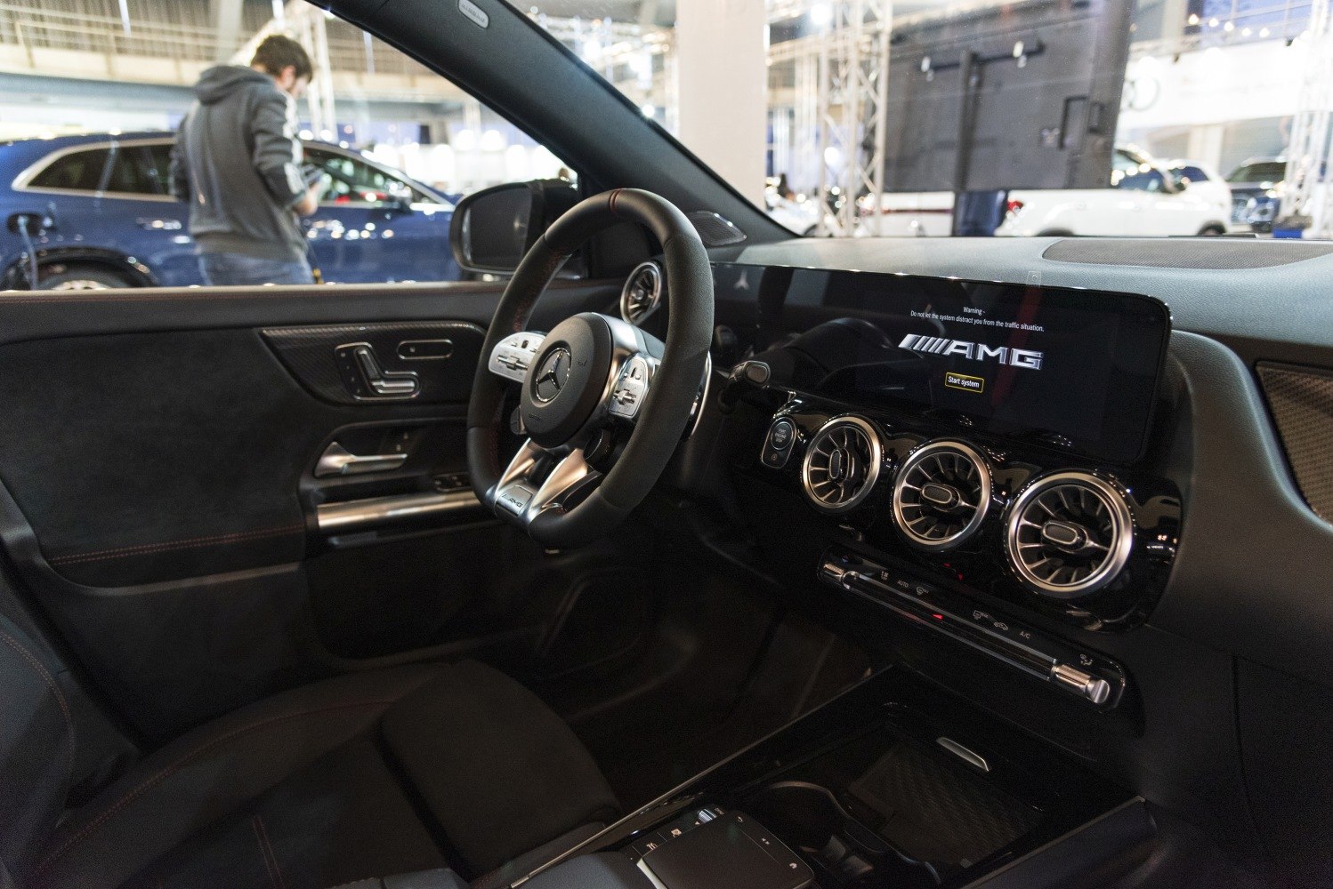 AMG-branded digital dashboard, multi-function steering wheel, turbine-style air vents