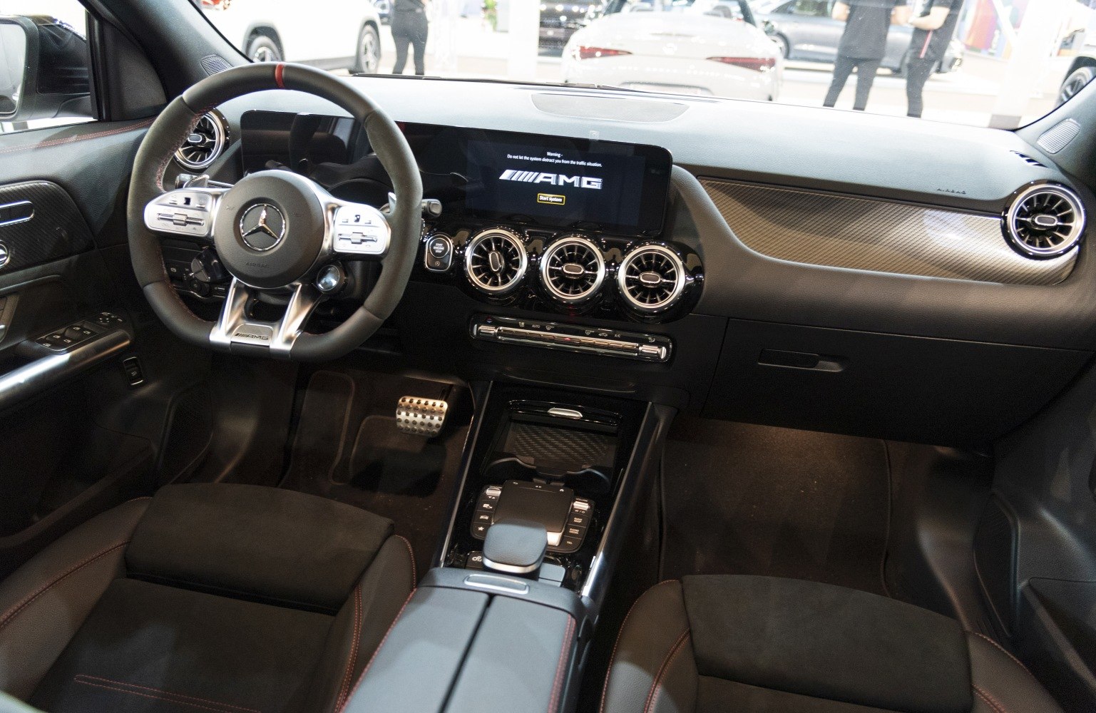 AMG steering wheel and dashboard with carbon trim and advanced infotainment