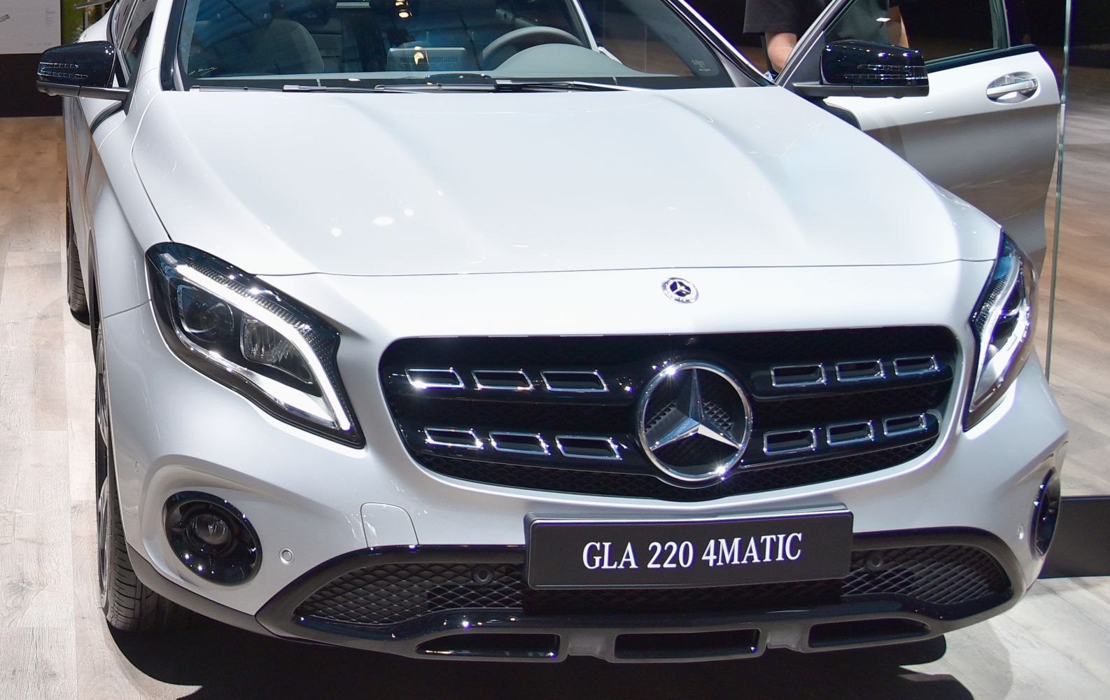 Front grille and LED headlight design of luxury compact SUV.