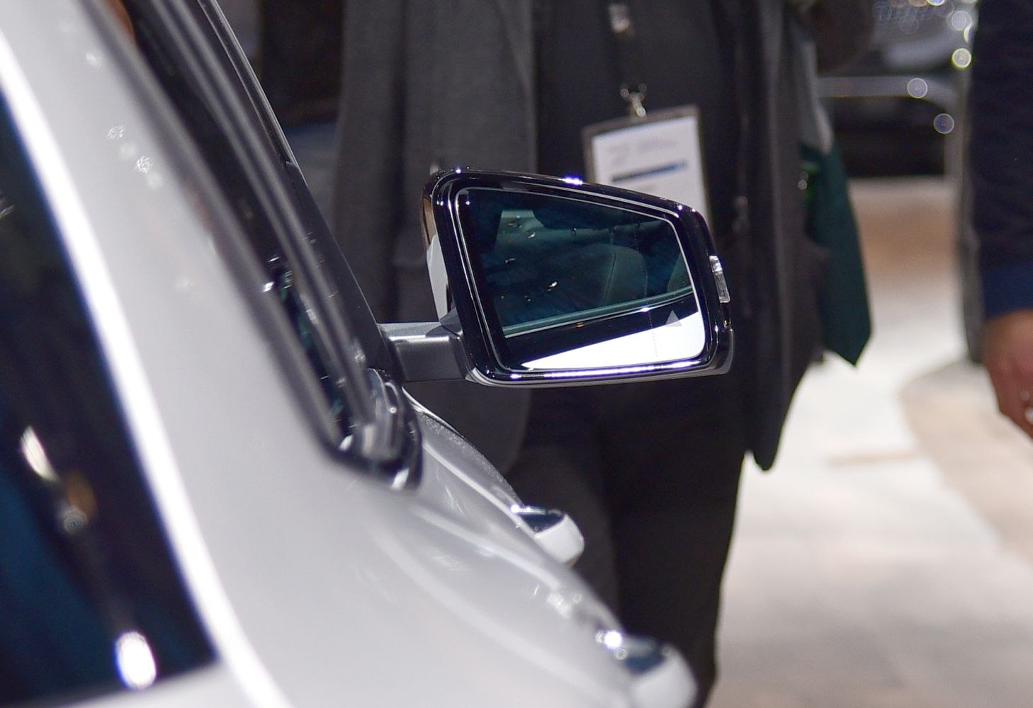 Side mirror close-up with integrated turn signal and sleek design