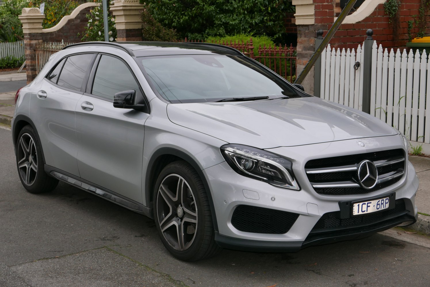 Front-side view with LED headlights and alloy wheels