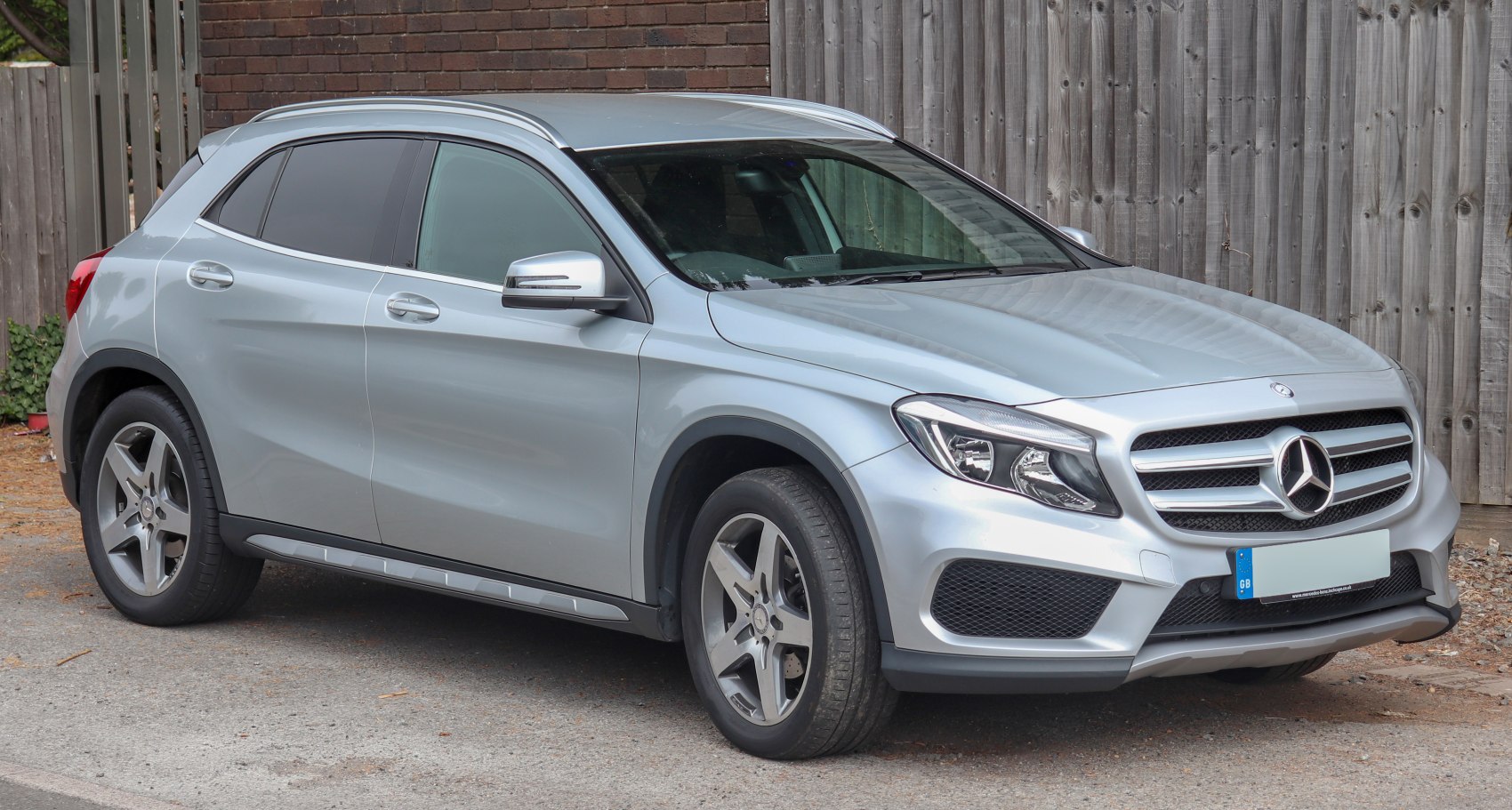 Silver compact SUV front side with grille and headlights