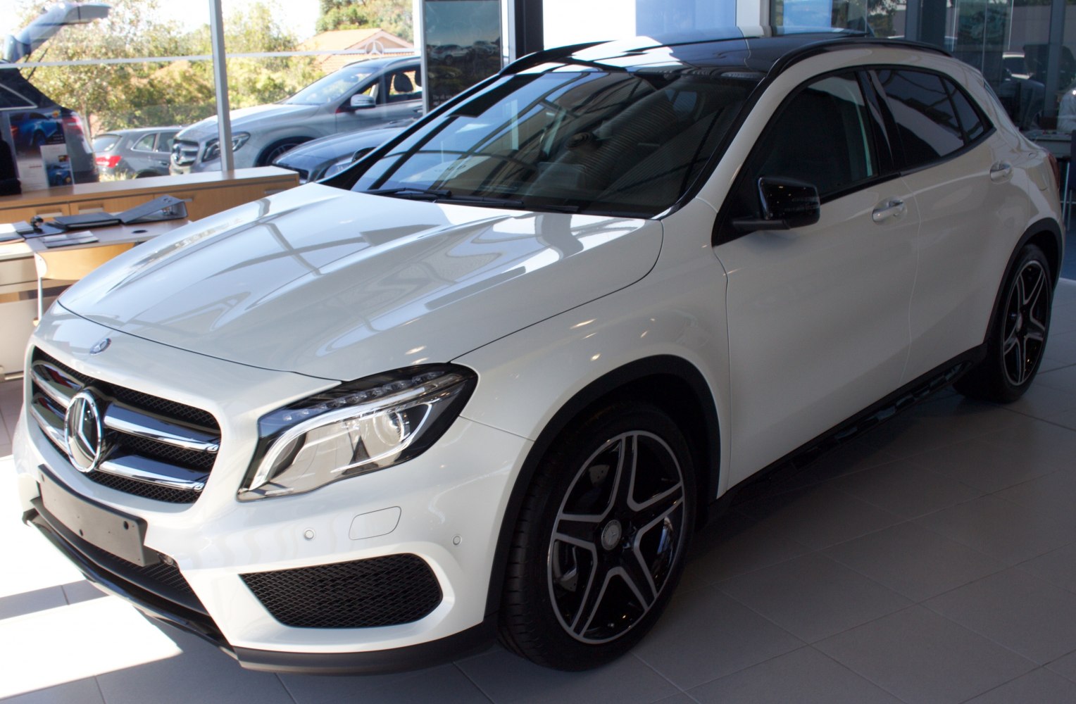White luxury compact SUV with LED headlamps and sporty alloy wheels
