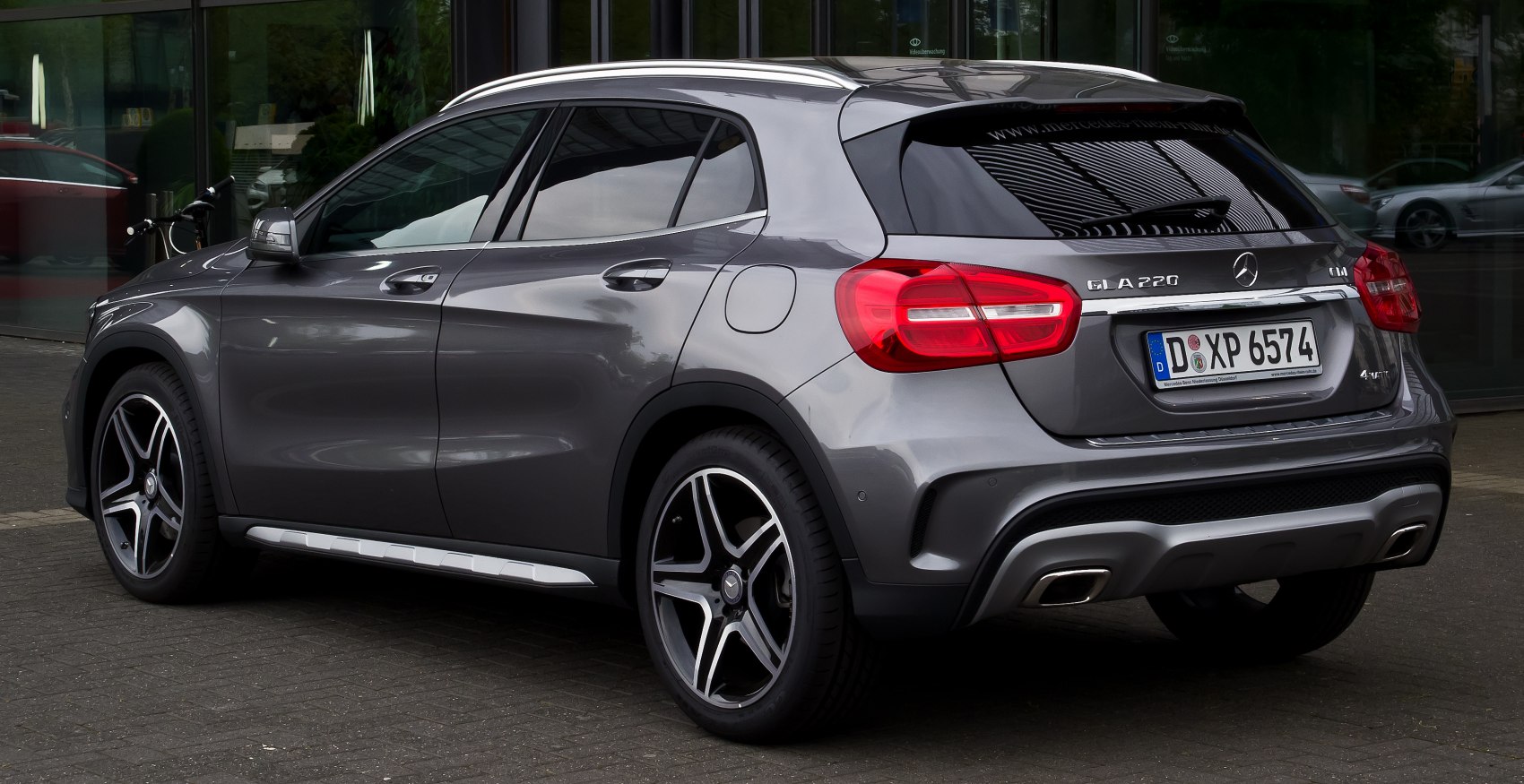 Rear side view with distinctive taillights and alloy wheels