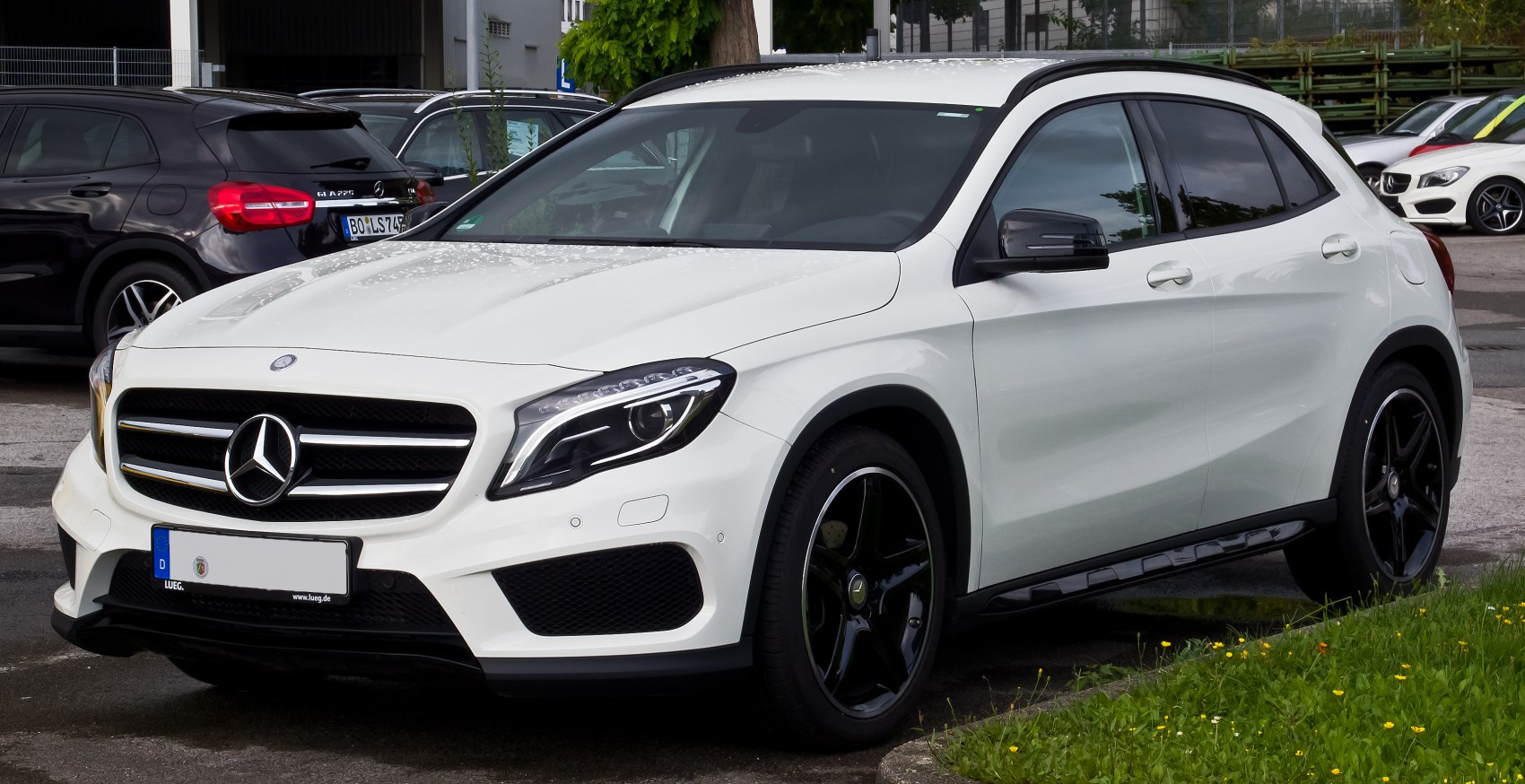 White SUV front profile with LED headlights and black alloy wheels