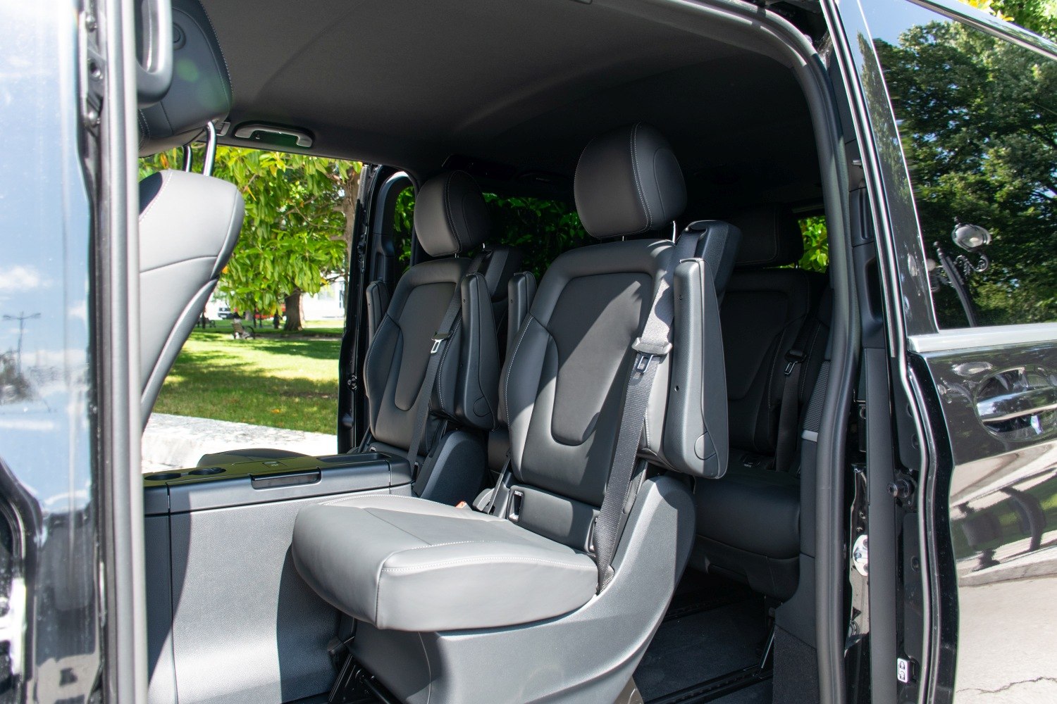 Premium leather seats with integrated seat belts in spacious vehicle cabin