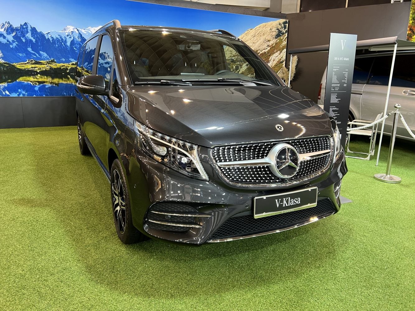 Front view showcasing grille and headlights of a luxury van