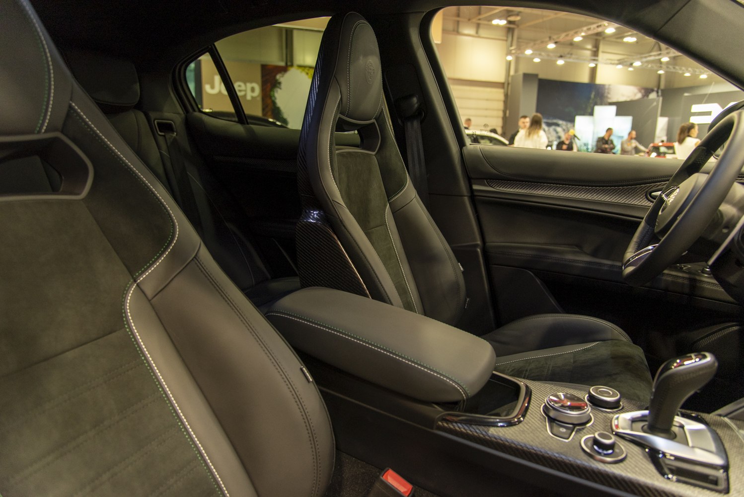 Luxury bucket seats and carbon fiber trim in car interior