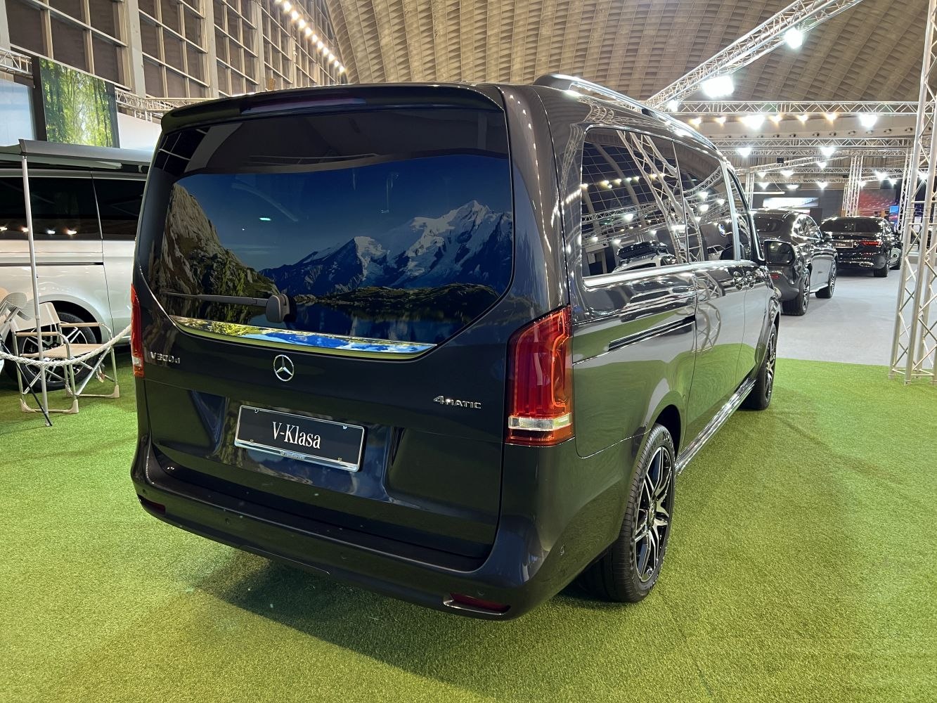 Rear and side view of luxury van with tinted windows and 4MATIC badge