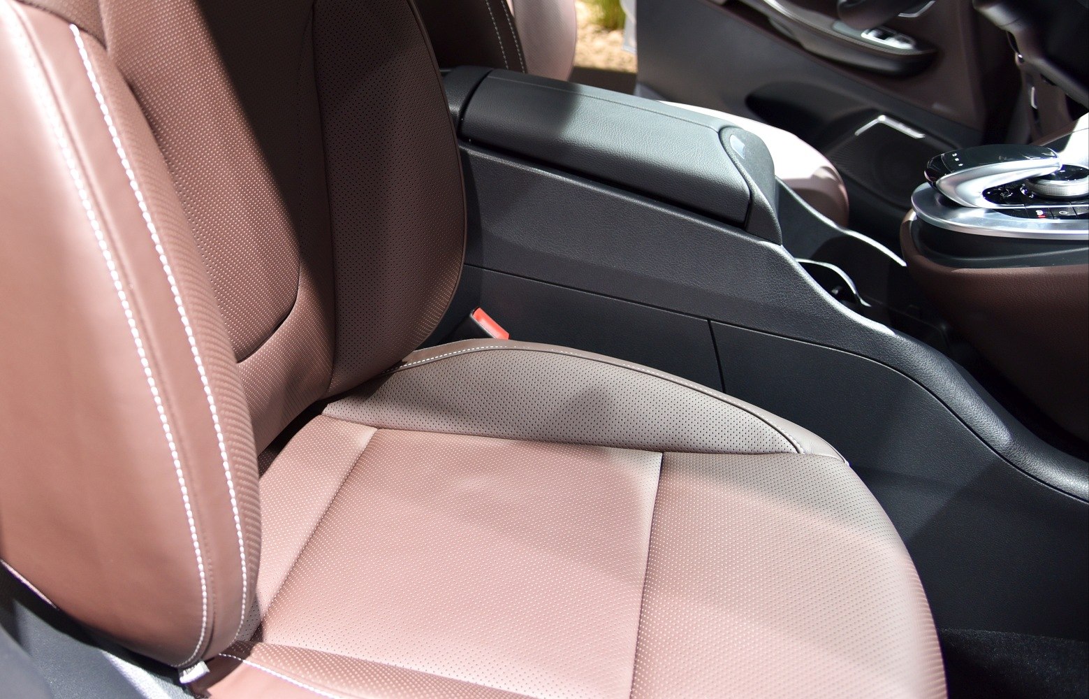 Perforated leather front seat and center console with armrest