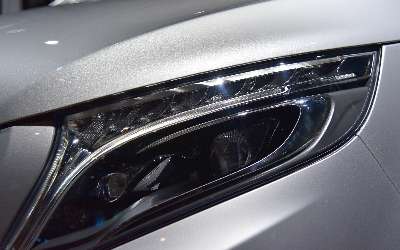 Close-up of sleek, modern car headlight with distinctive LED elements