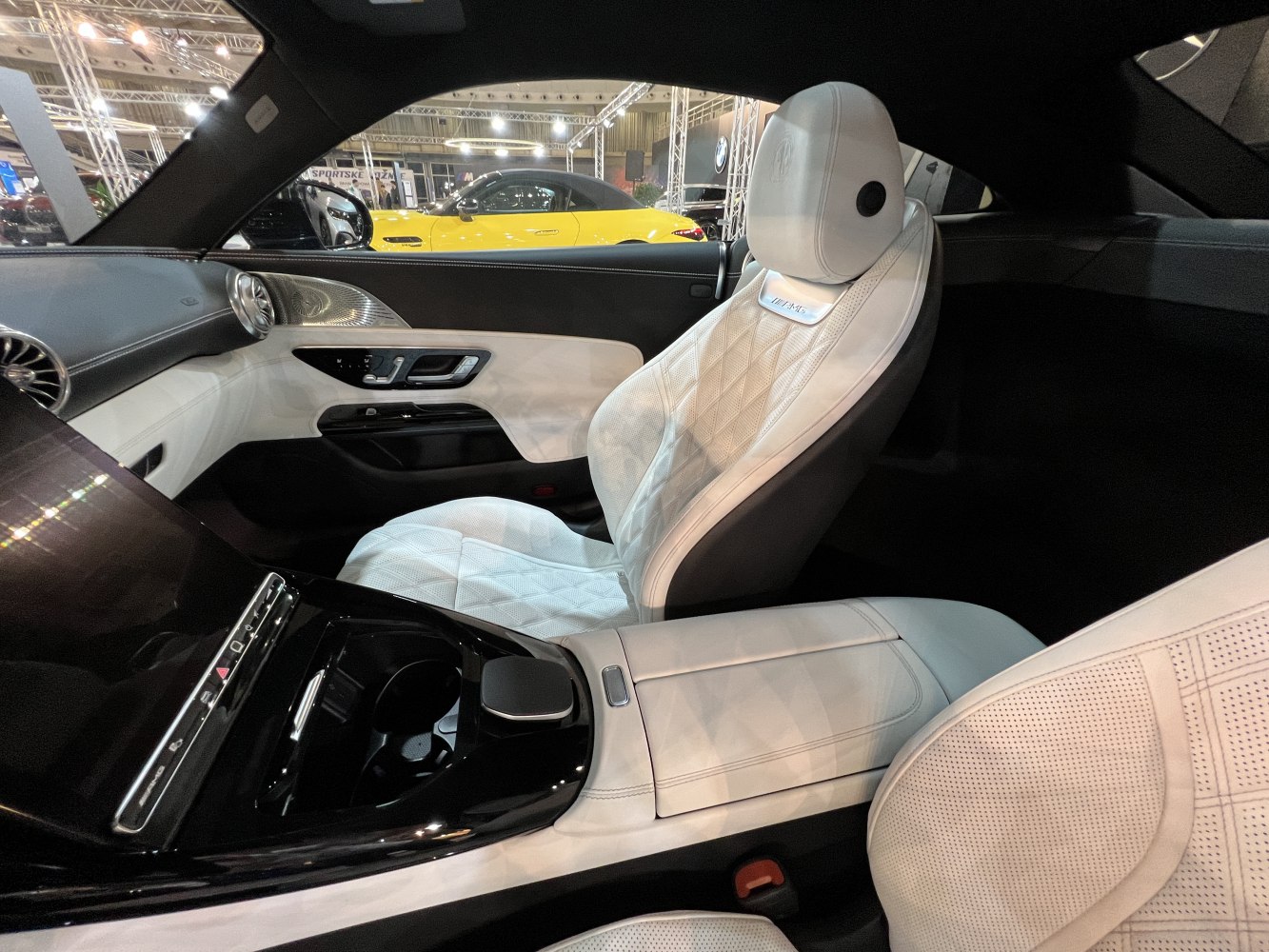 White quilted leather seats and advanced black center console.