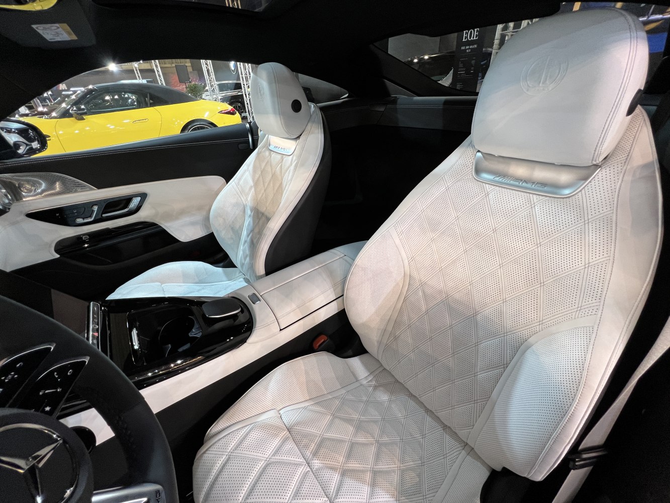 White quilted leather luxury seats with AMG branding.