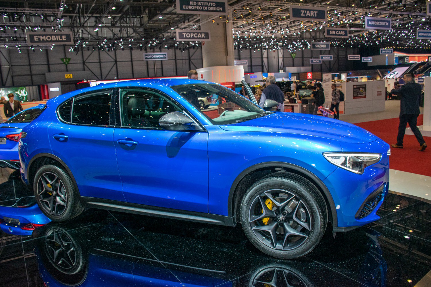 Side profile of blue SUV with alloy wheels and sleek design
