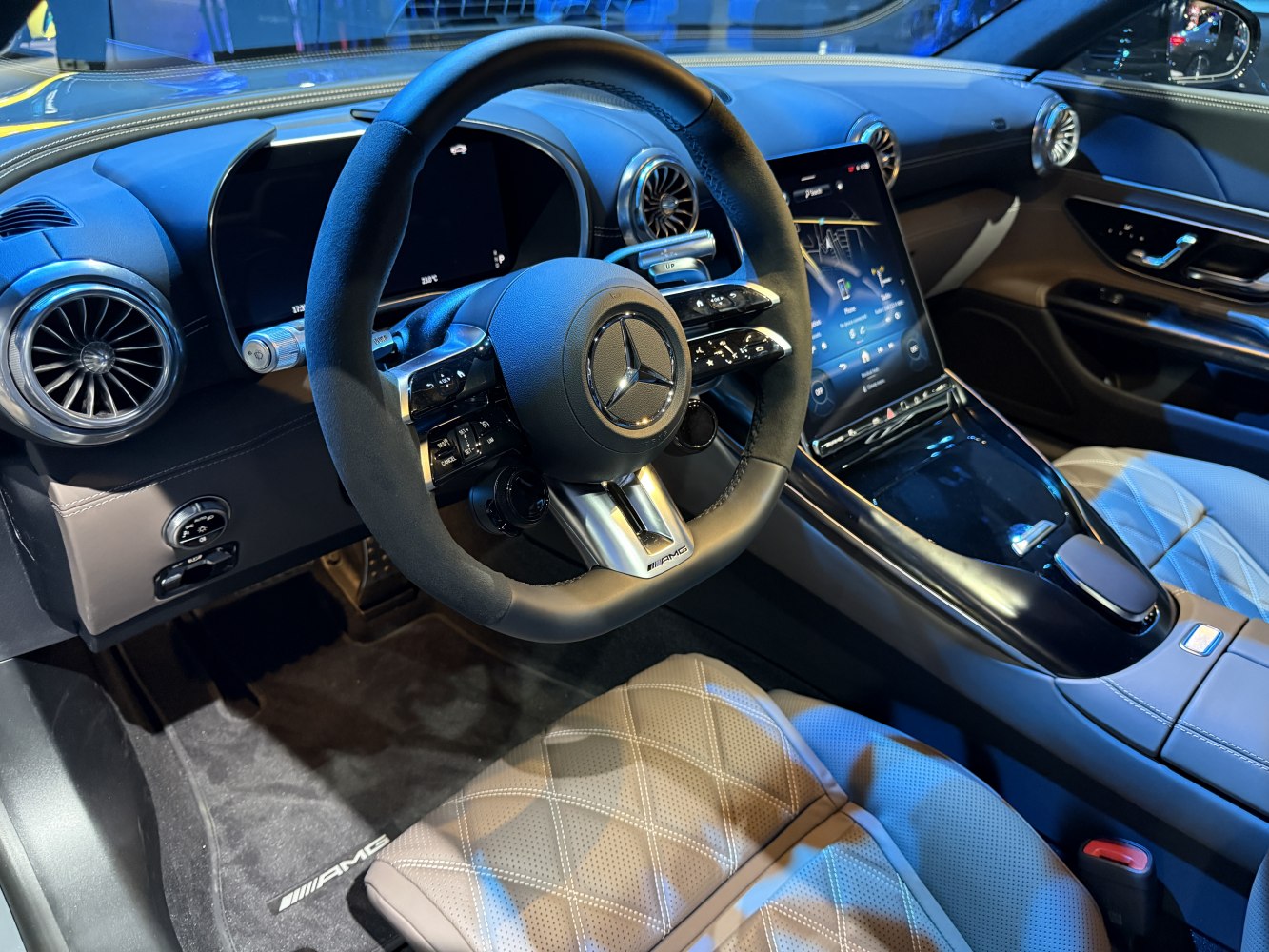 Digital instrument cluster and touchscreen with quilted leather seats