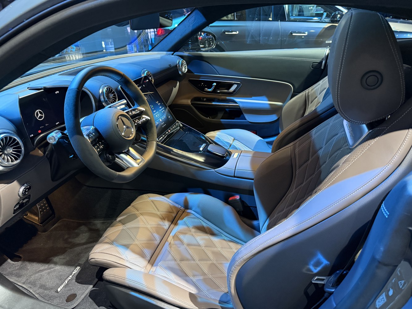 Digital dashboard and diamond-stitched sport seats with sleek touchscreen console