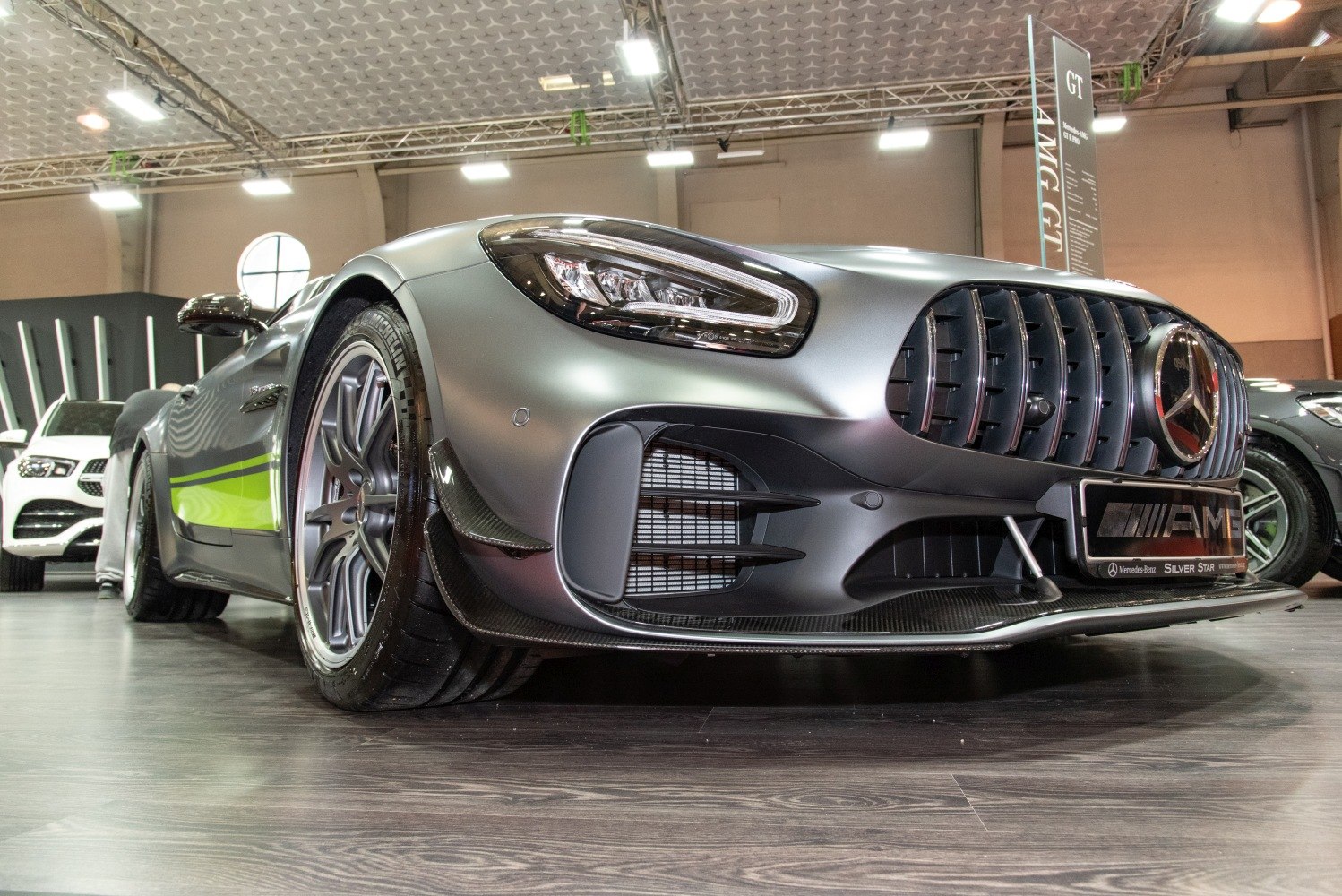 Front grille and LED headlights close-up with aerodynamic front splitter