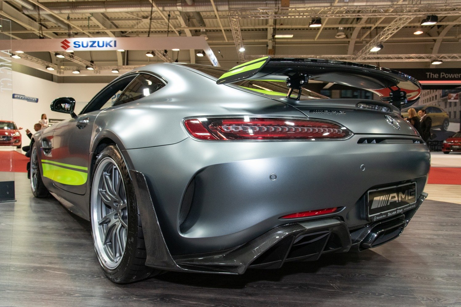 Rear view with carbon fiber diffuser and large rear wing spoiler.