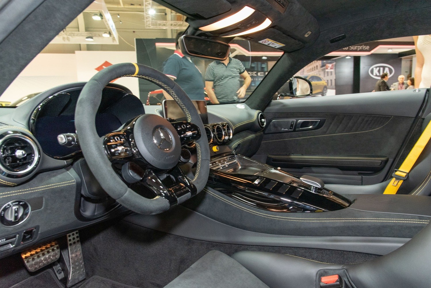 Luxury sports car interior with digital dashboard and sport steering wheel