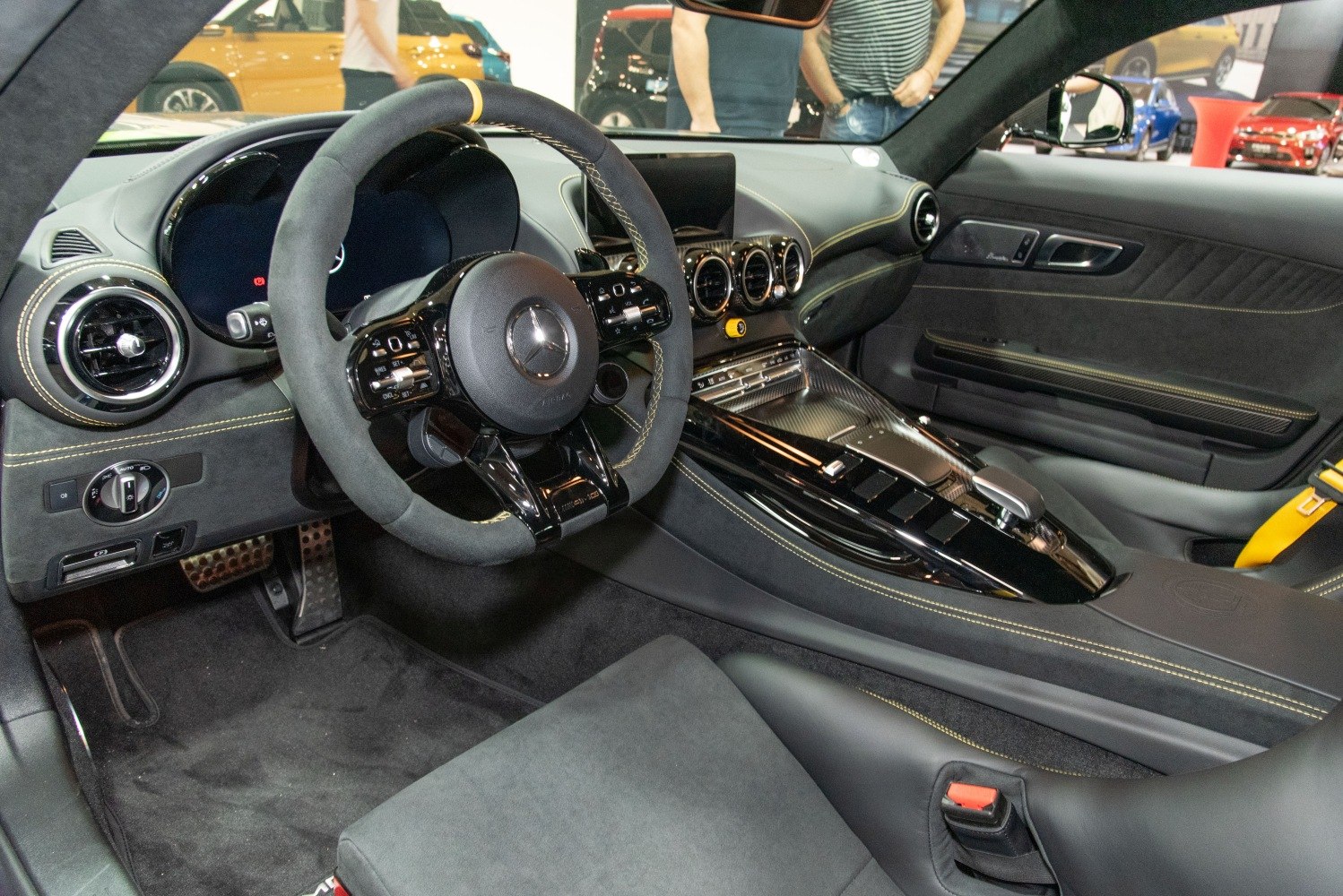 Luxury sports car interior with steering wheel and dashboard