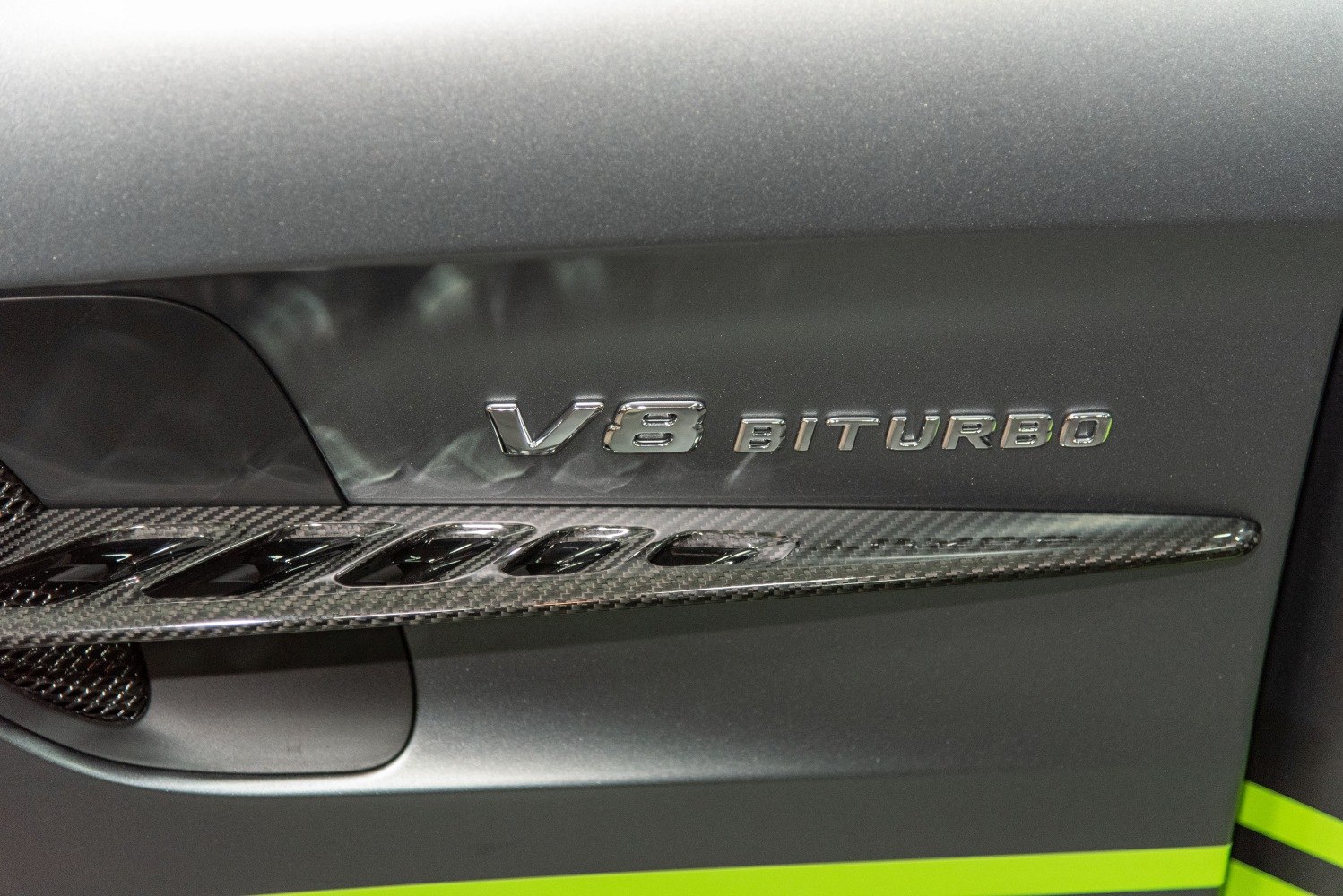 Close-up of V8 Biturbo badge and carbon fiber trim