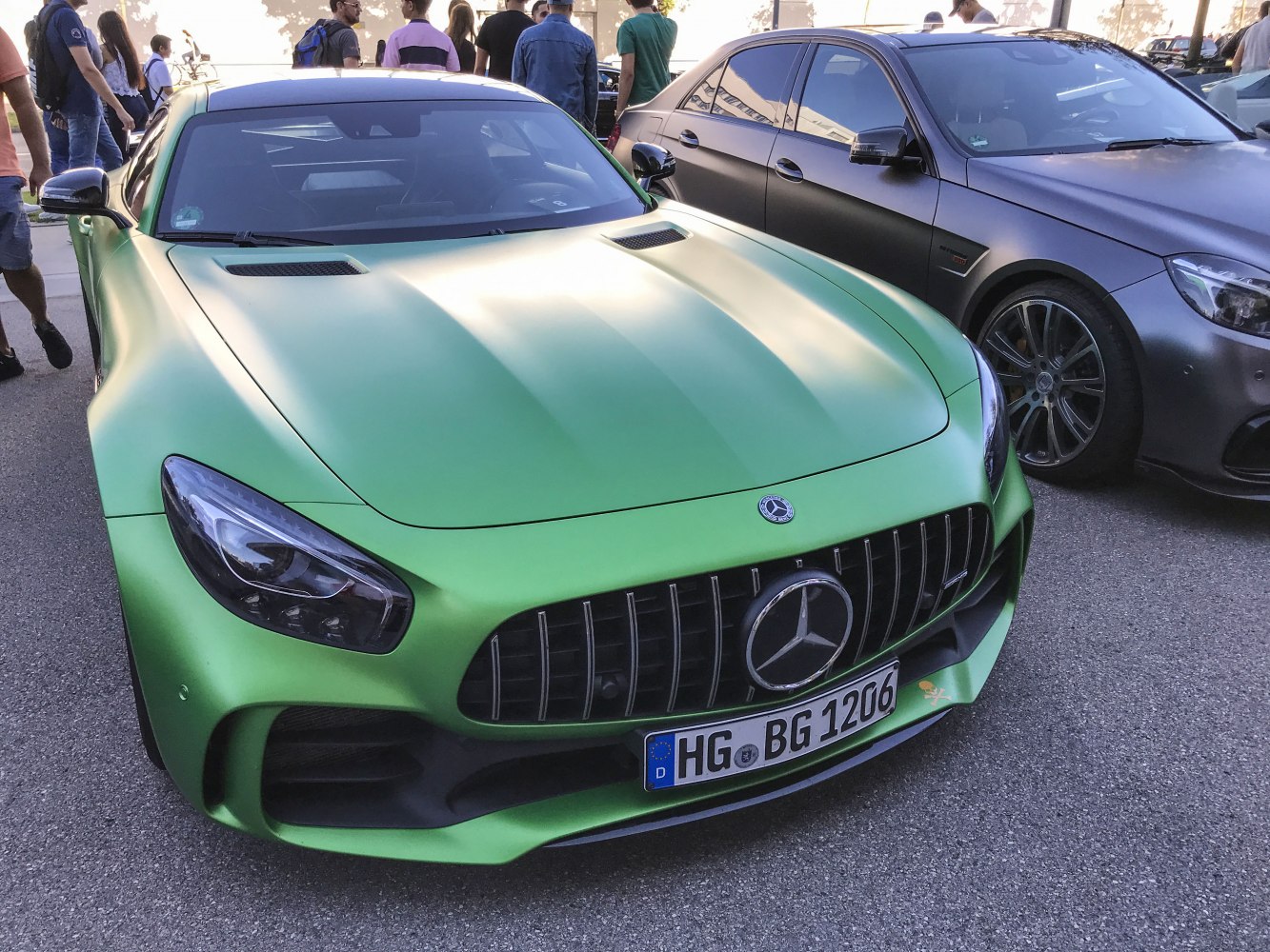 Green matte front with vertical grille and sleek headlights