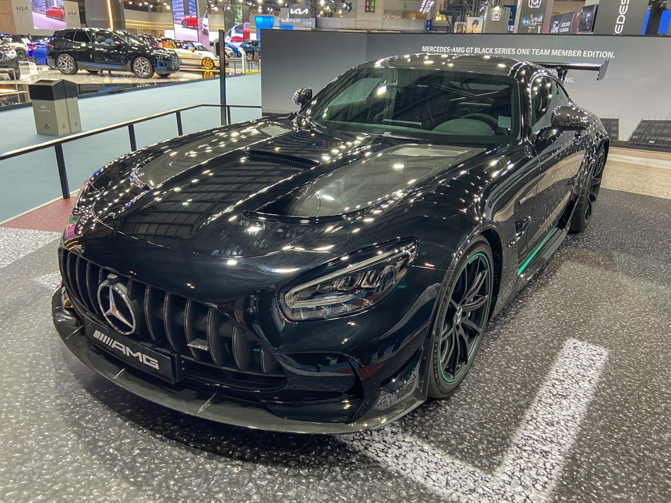Front view with carbon fiber hood and aggressive grille