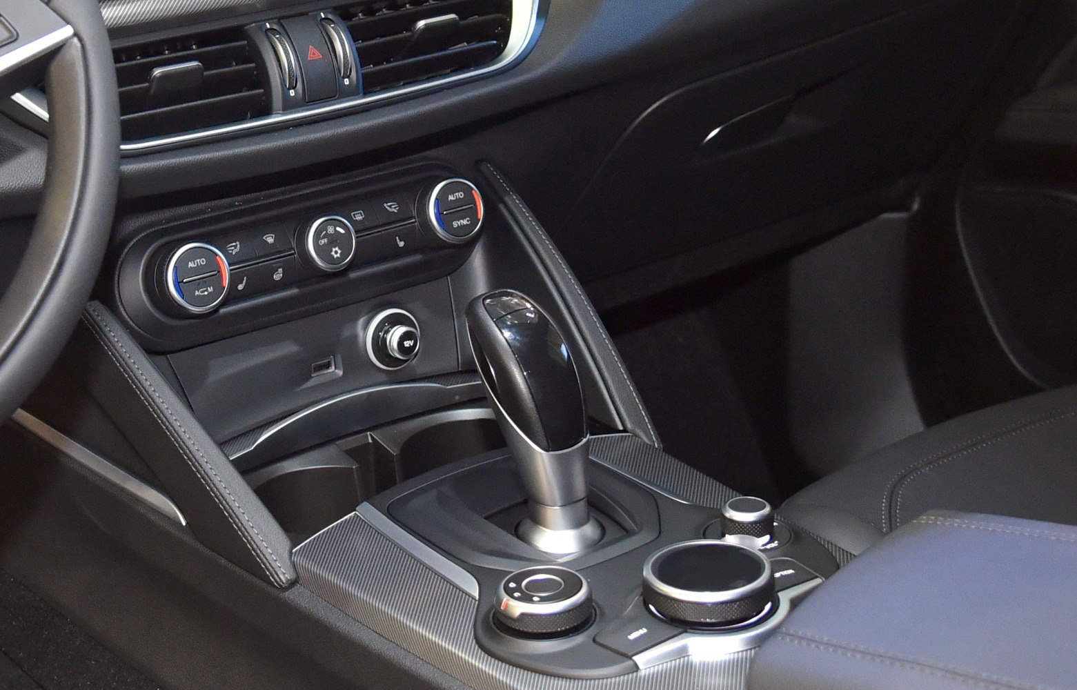 Car interior with gear shift lever and climate control dials