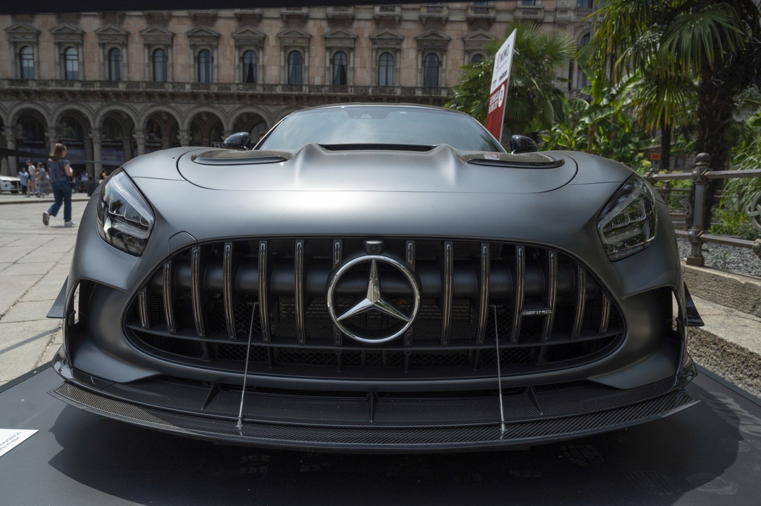 Matte black front fascia with vertical Panamericana grille and aggressive headlights