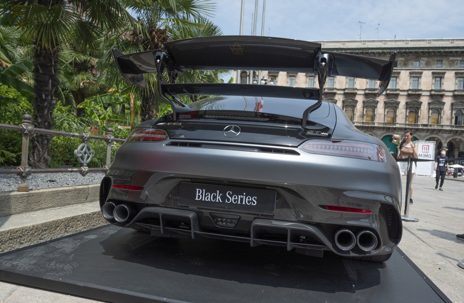 Rear carbon fiber wing and quad exhaust tips of a sportscar