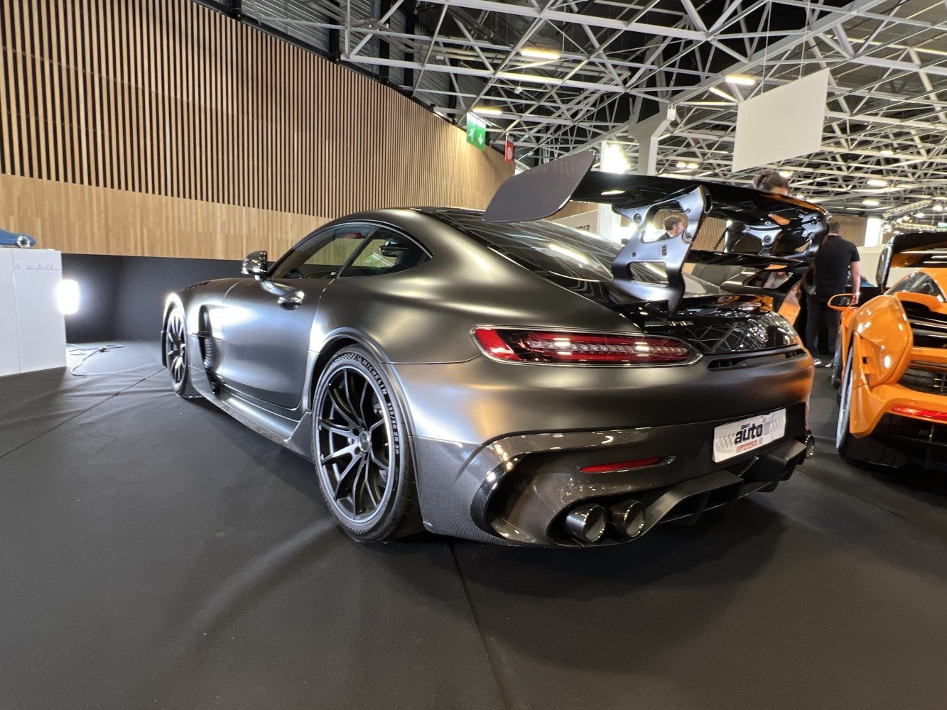 Sporty coupe rear view with widebody and large spoiler