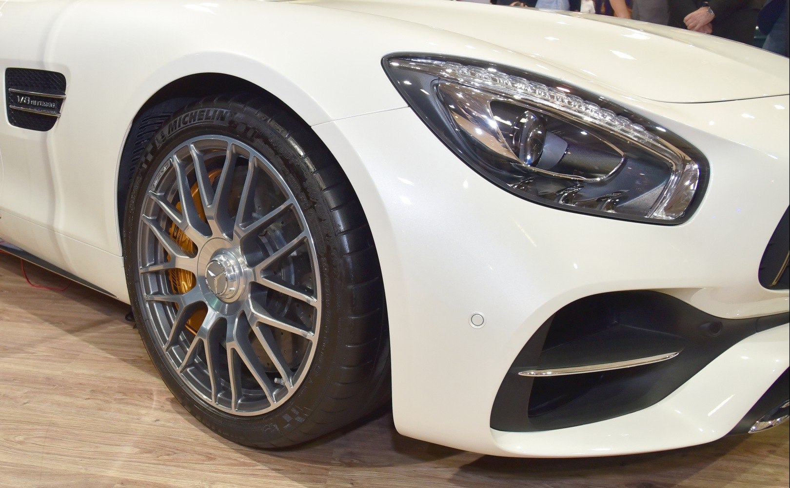Front wheel and headlight detail with alloy wheel and LED headlight.