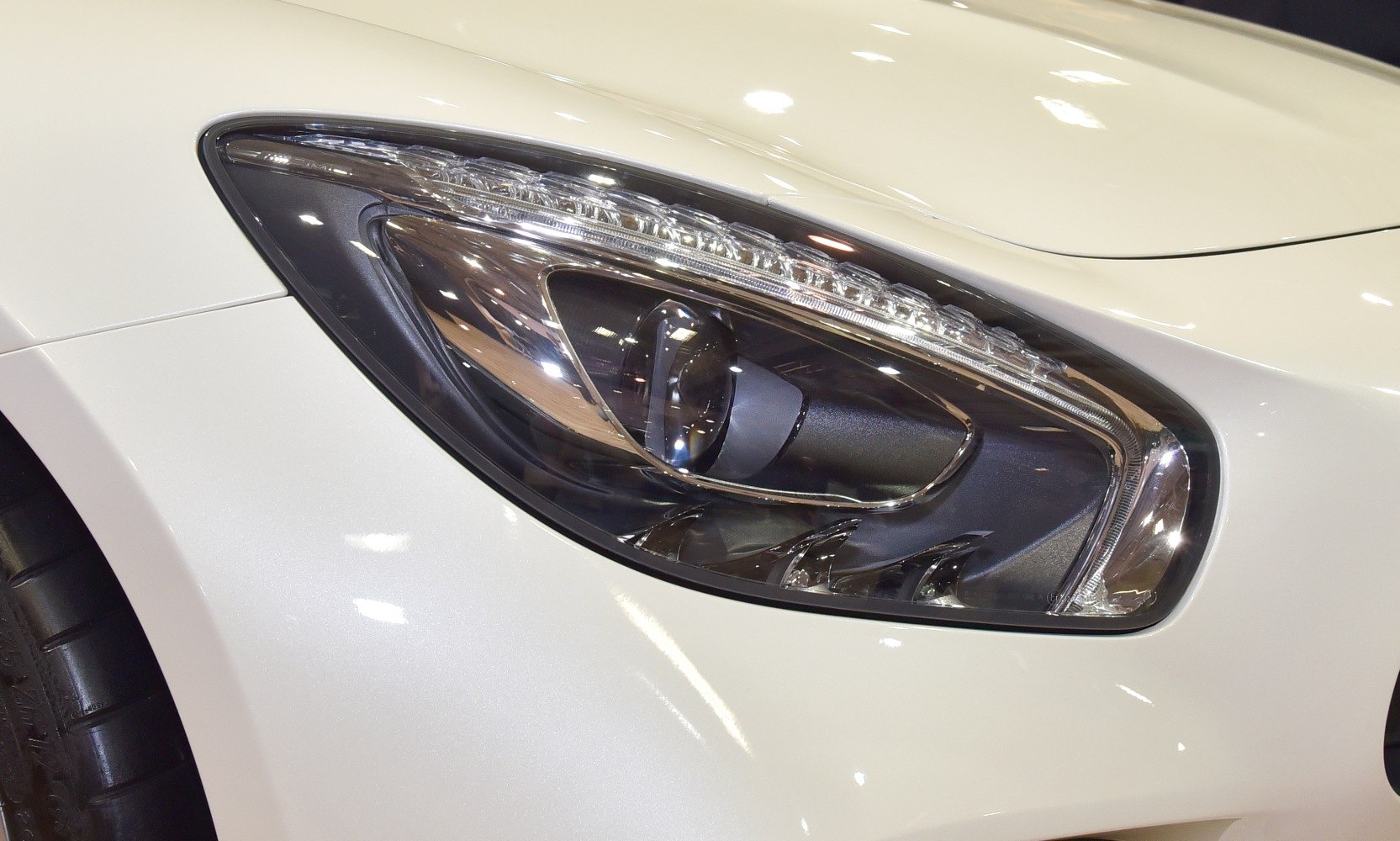 Close-up of sleek headlight with LED elements and smooth contours