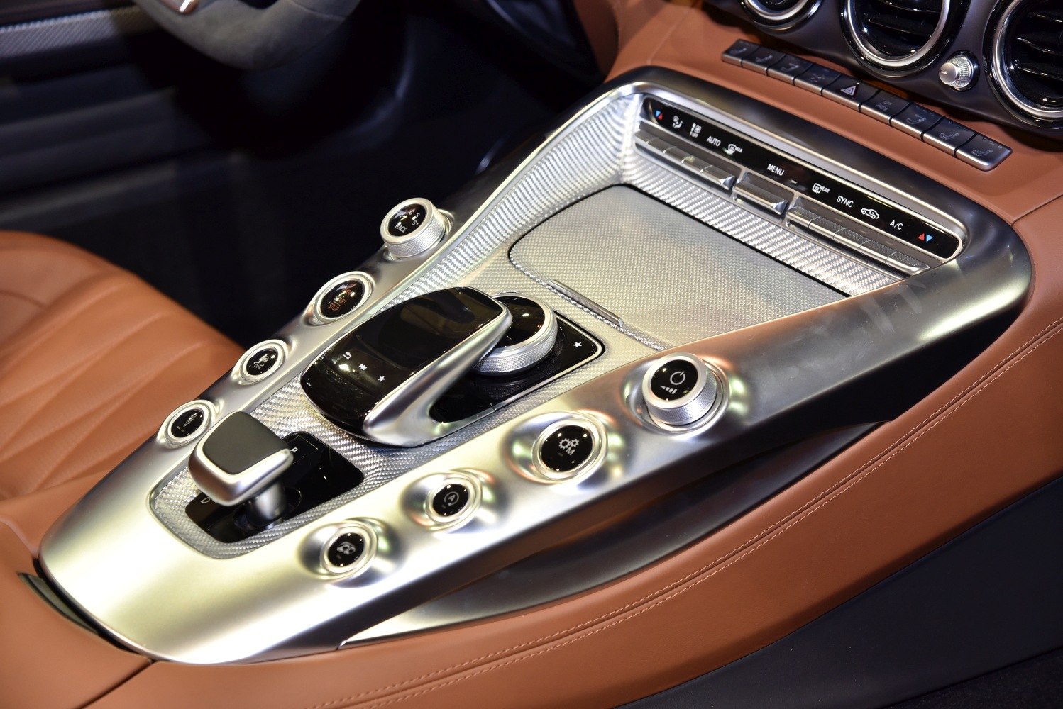 Detailed center console with controls and luxurious leather interior