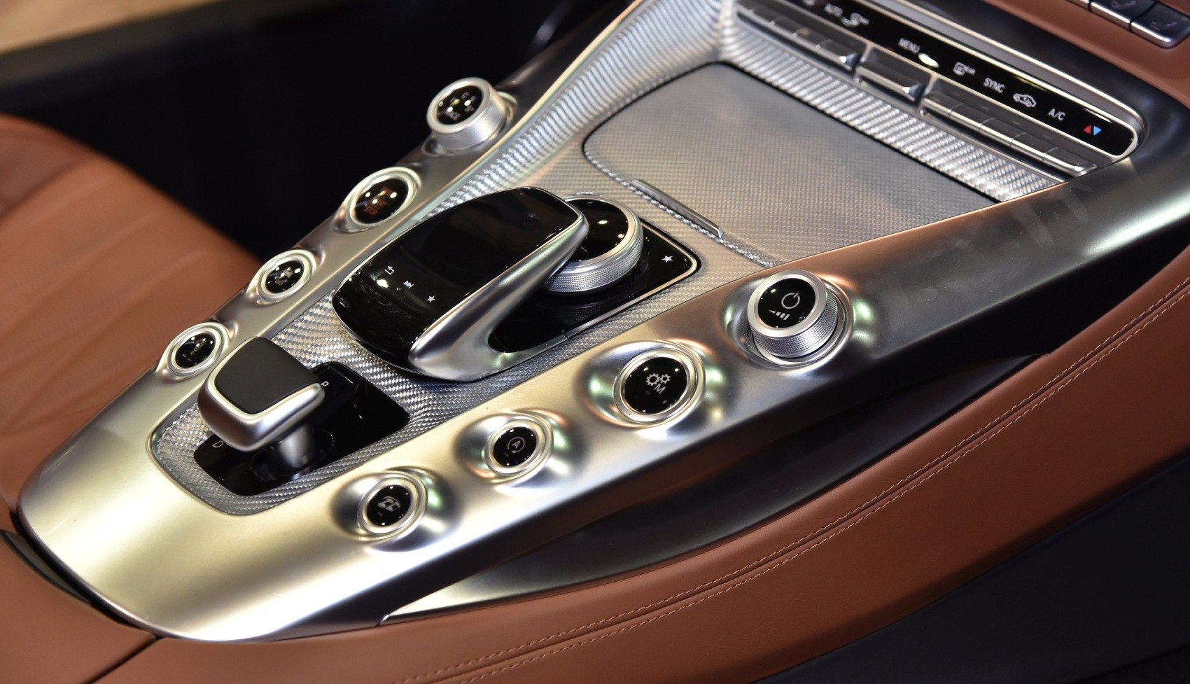 Central console with metallic buttons and touchpad