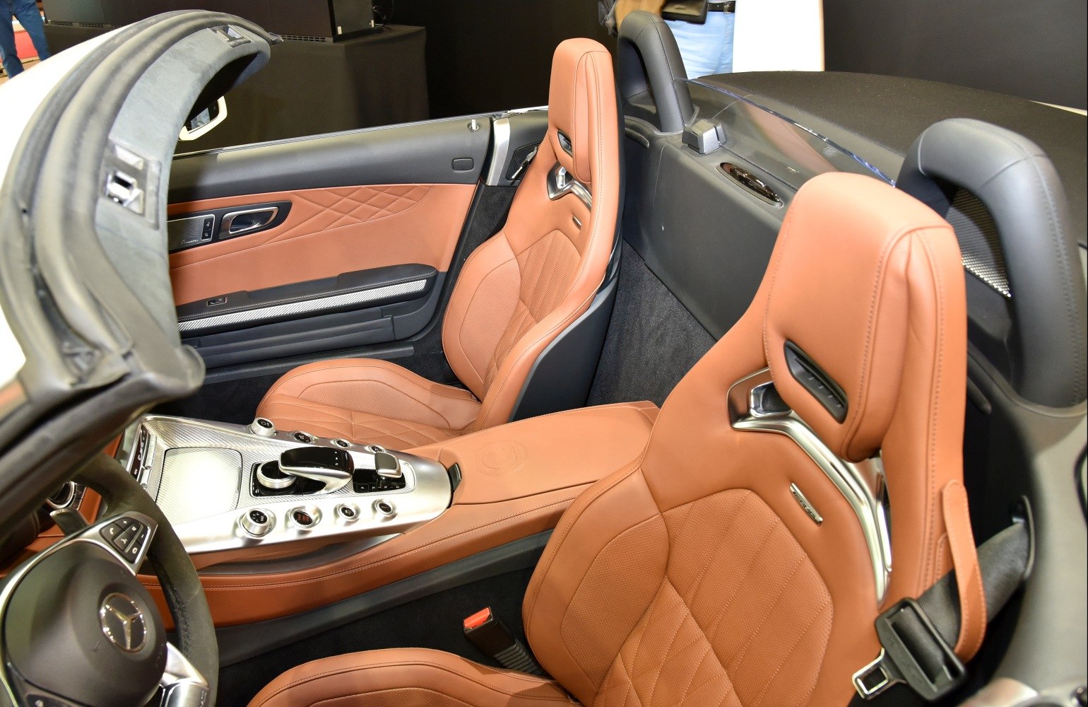 Brown leather seats with center console and controls