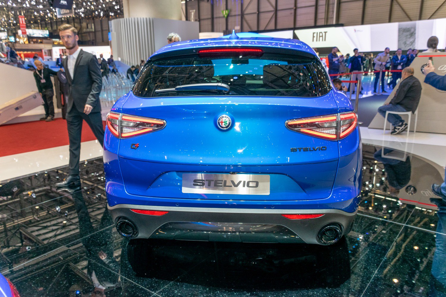 Rear view with distinct tail lights and dual exhausts