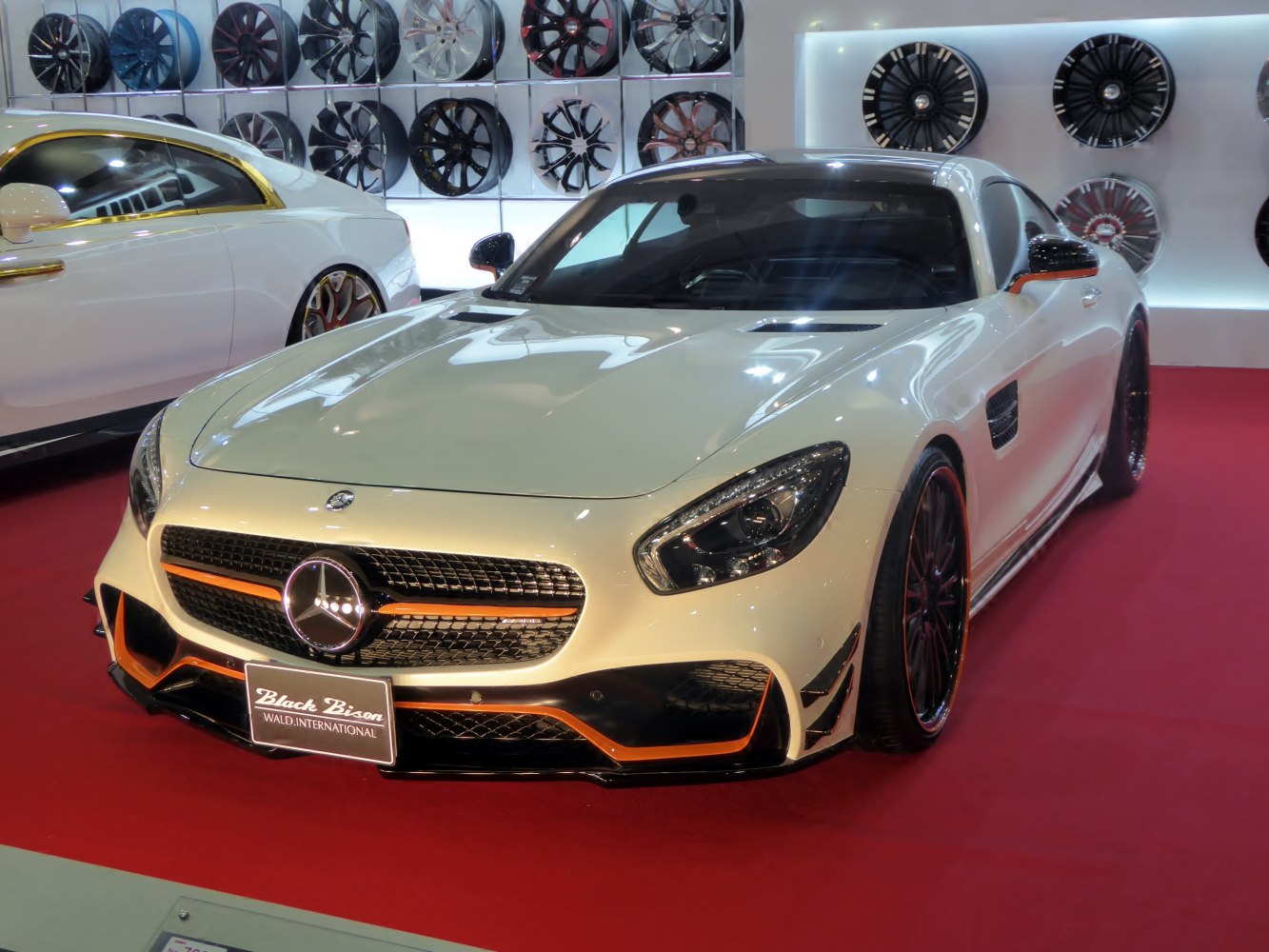 Front view of sports car with custom black and orange accents