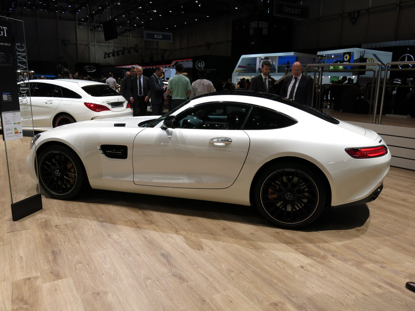 Sleek white sports coupe side profile with V8 Biturbo badge and black wheels