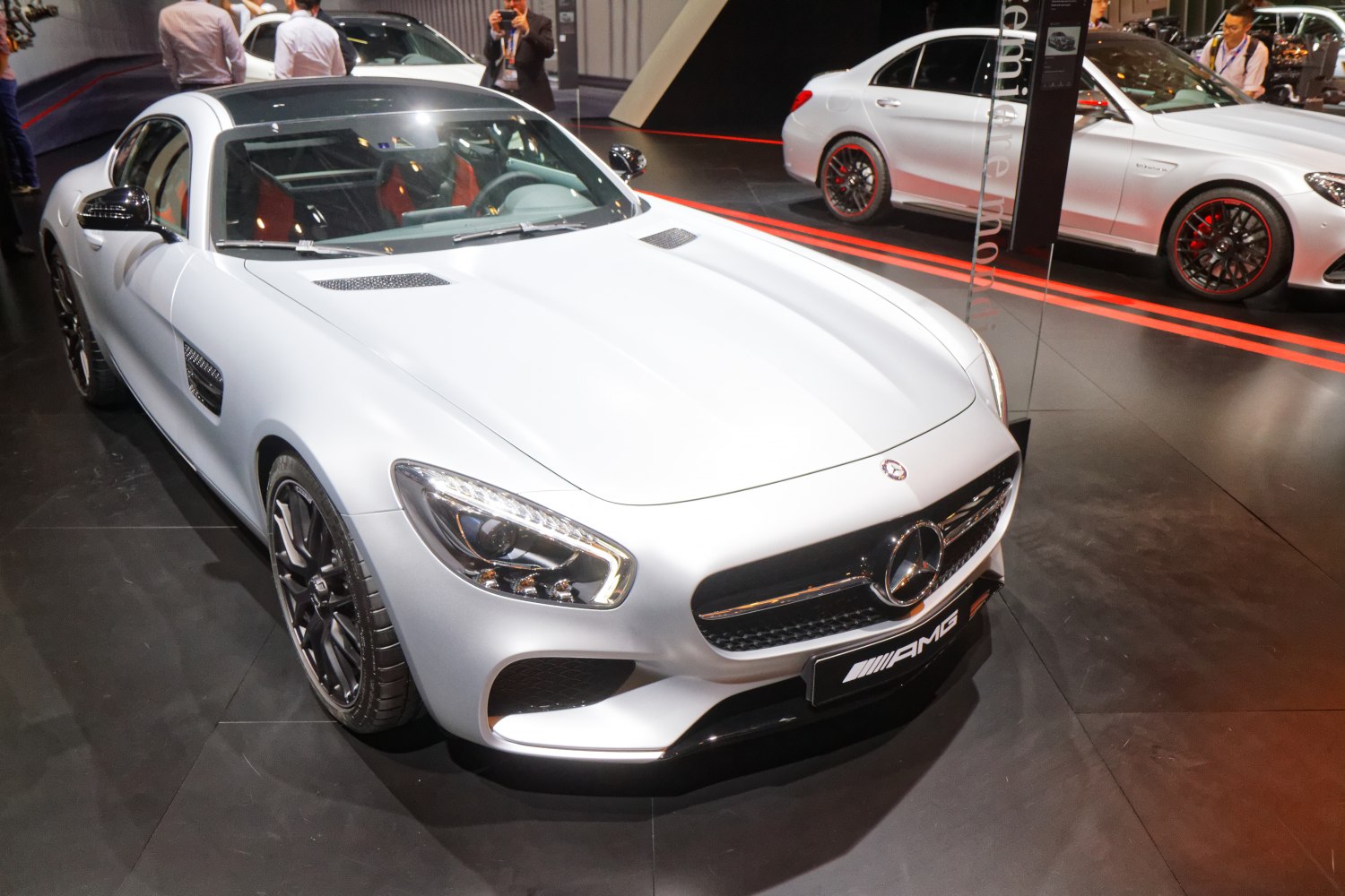 Front angle with sleek hood, headlamps, grille, and aerodynamic side vent