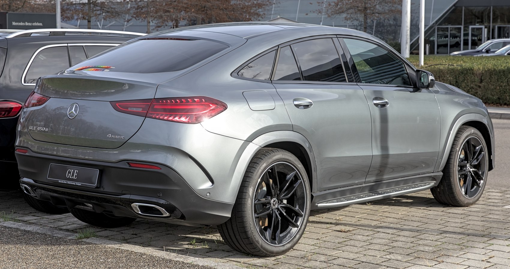 Luxury SUV coupe rear with black alloy wheels and dual exhausts