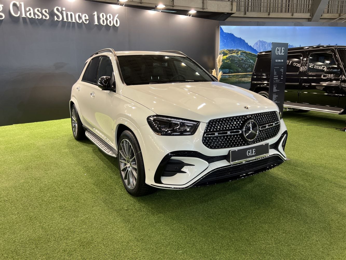 Front view of SUV with distinctive grille and LED headlights