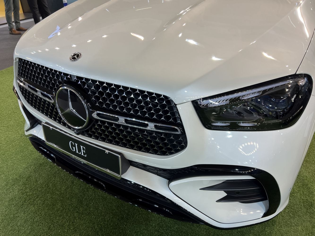 Close-up of SUV front grille and advanced LED headlight