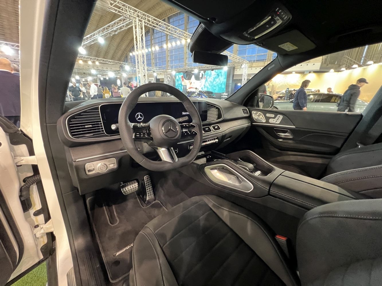Luxury SUV interior with digital cockpit and advanced steering wheel controls