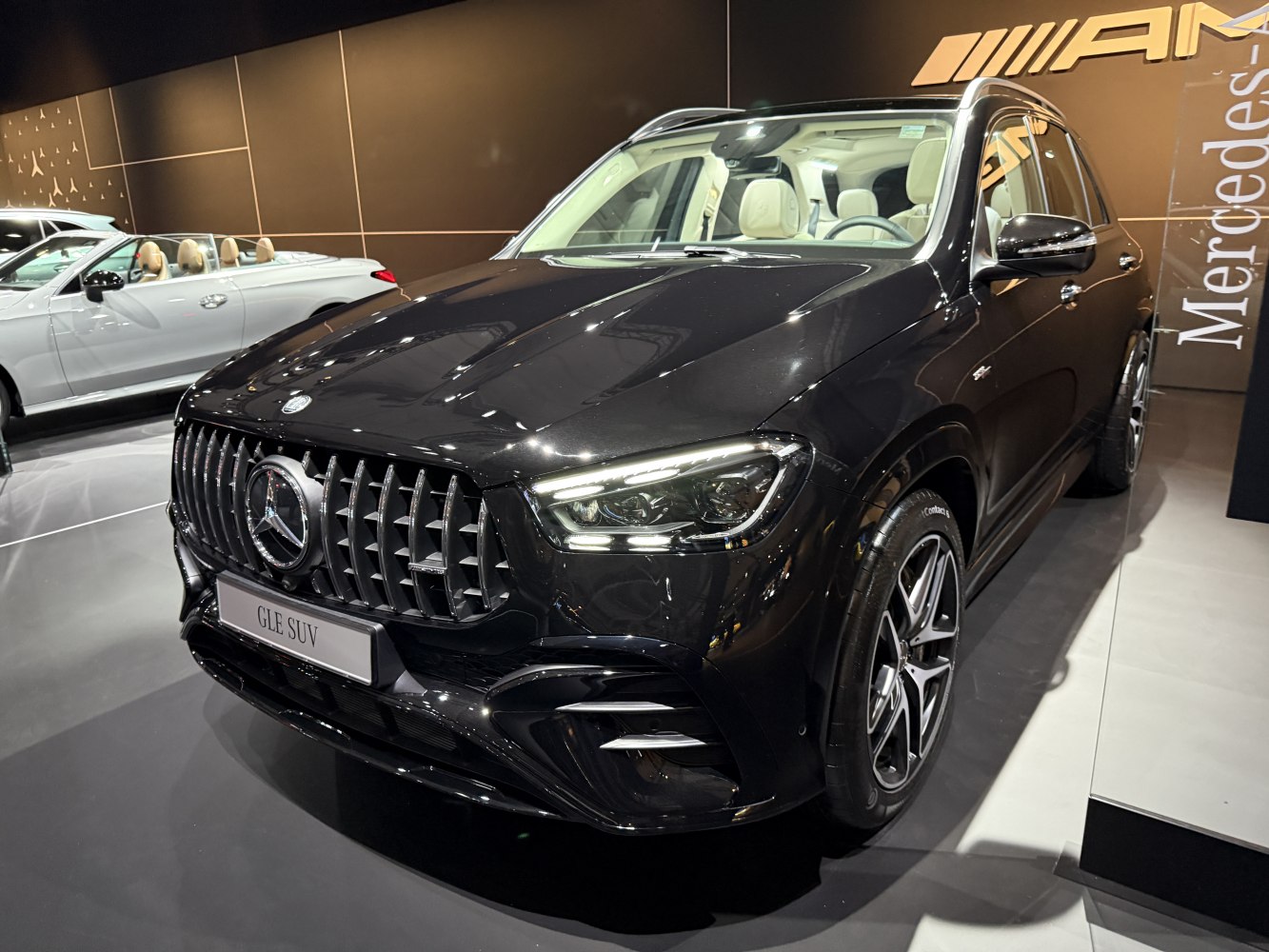Front view of luxury SUV with AMG grille and LED headlights