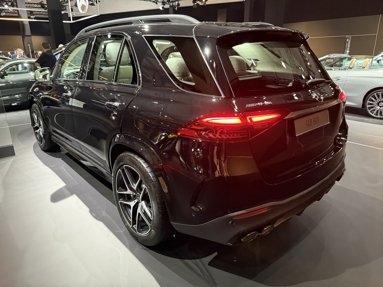 Rear exterior view with distinctive tail lights and alloy wheels