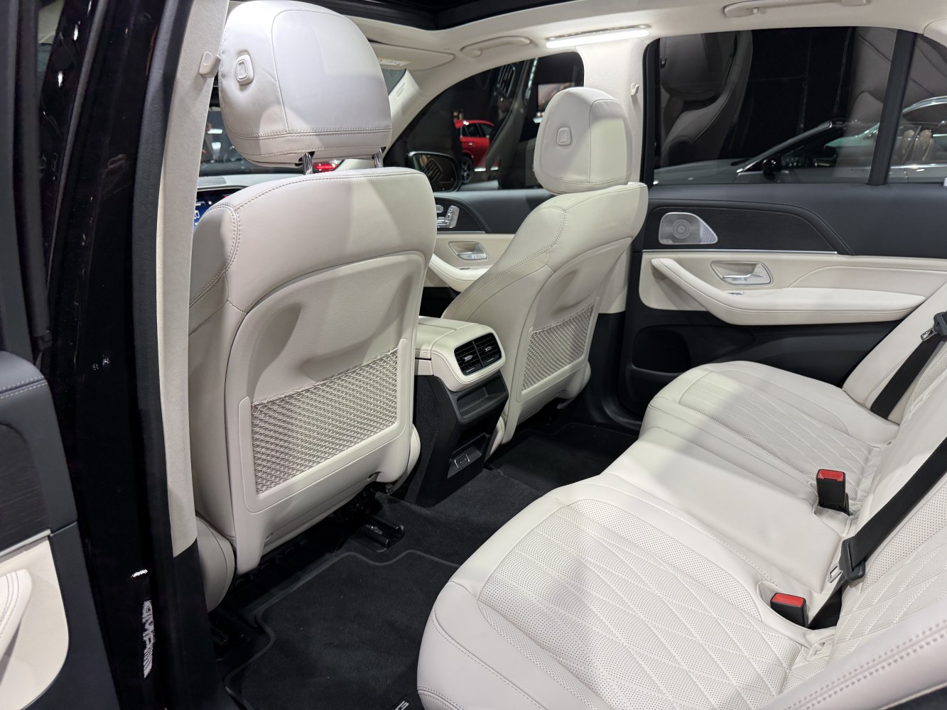 Rear interior with white leather seats and rear air vents