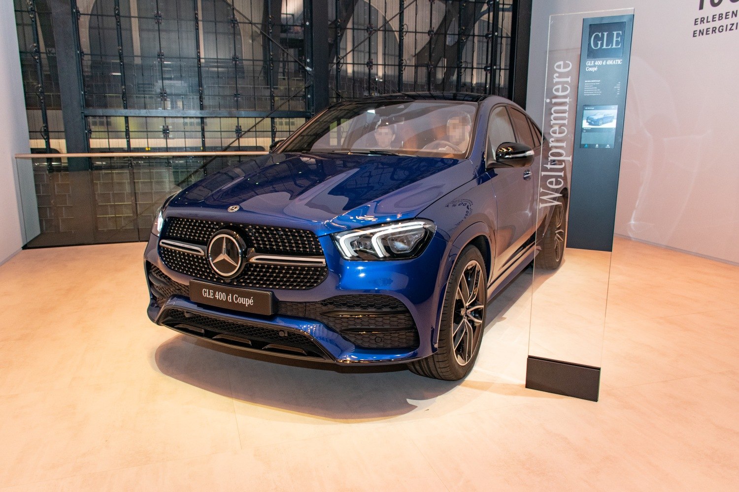 Front view of SUV with LED headlights and prominent grille