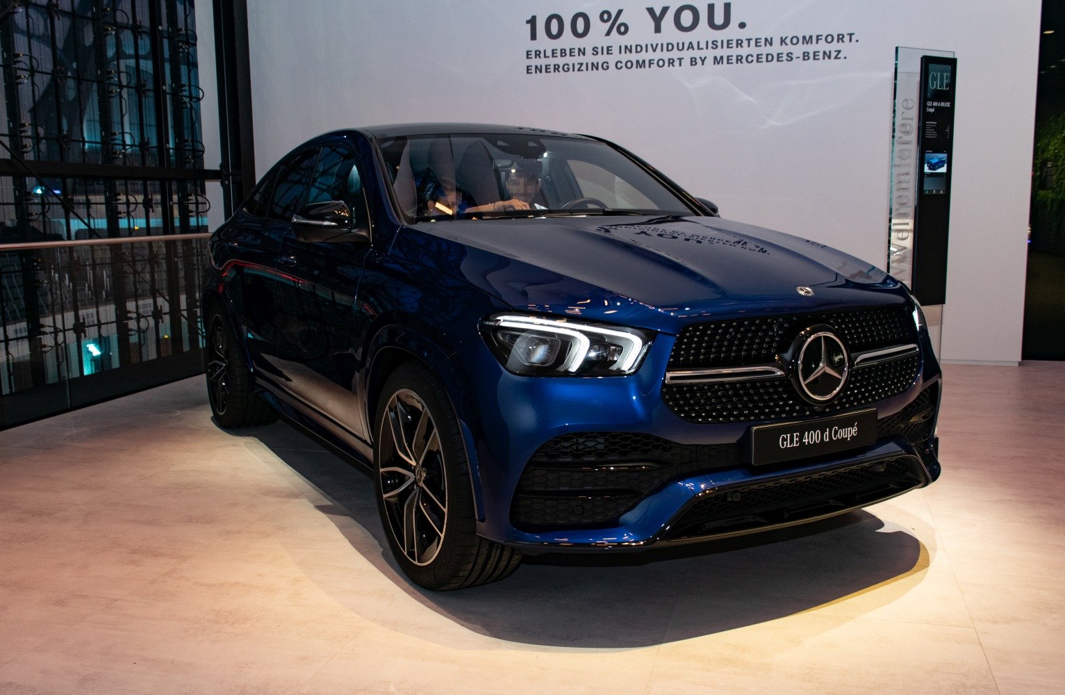 Sleek front grille with sharp LED headlights and black alloy wheels