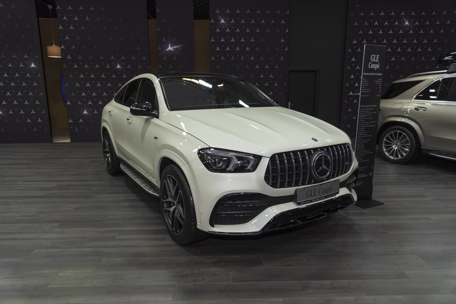 AMG grille and LED headlight design on luxury SUV coupe front
